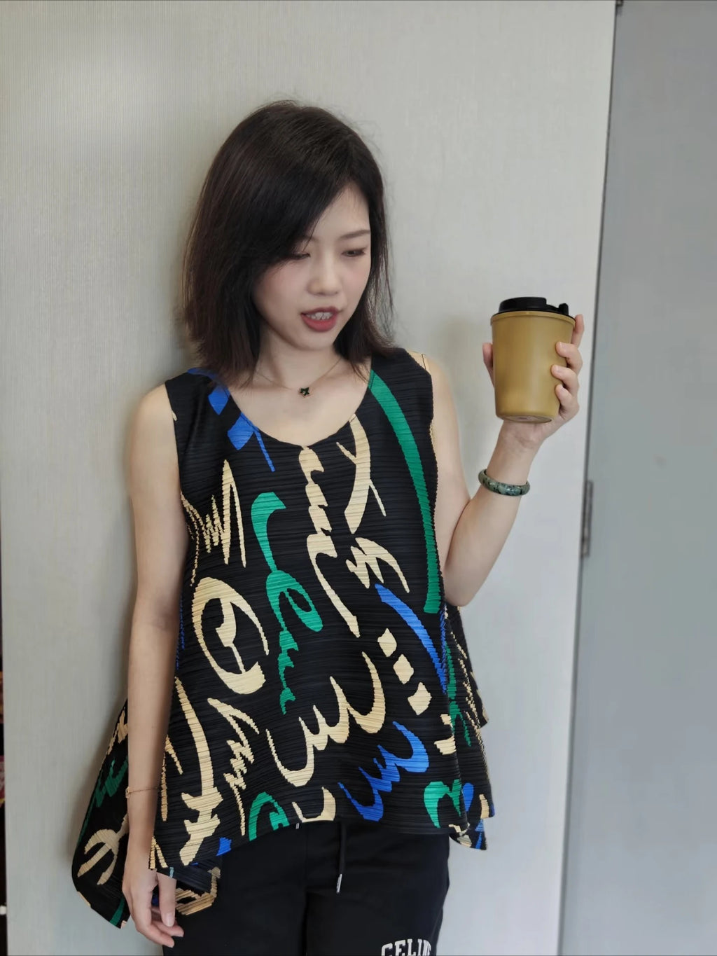 YUDX Vibrant Graffiti Print Miyake Pleated Asymmetric Sleeveless Top Lightweight Breathable Loose Fit Women's 2026 Summer Blouse
